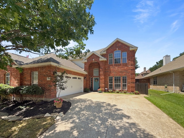 8600 La Quinta Ln, Mckinney, TX 75070 - traditional-style house featuring brick siding, an attached garage, driveway, and a shingled roof