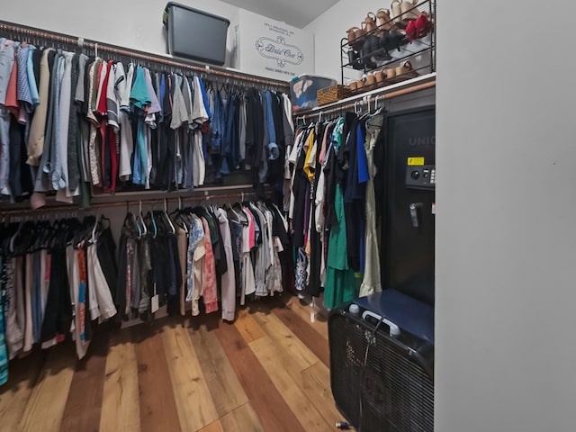 8600 La Quinta Ln, Mckinney, TX 75070 - walk in closet featuring wood finished floors