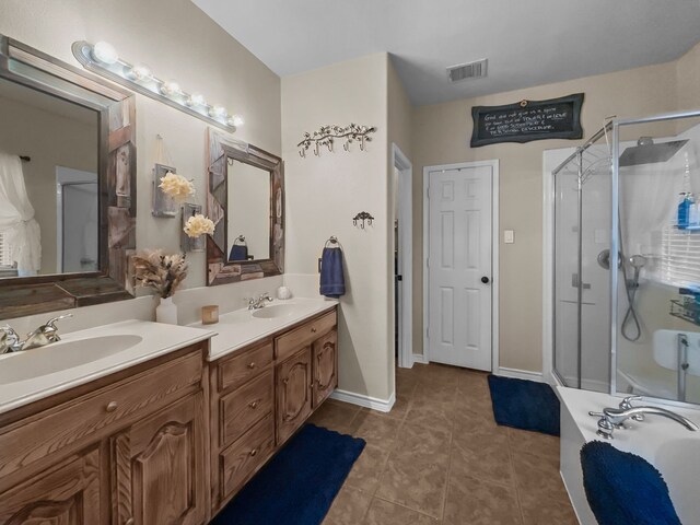 8600 La Quinta Ln, Mckinney, TX 75070 - bathroom with a shower stall, double vanity, tile patterned floors, and a garden tub