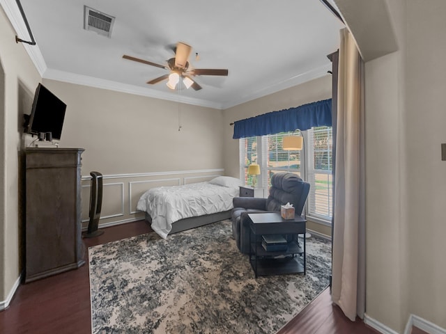 8600 La Quinta Ln, Mckinney, TX 75070 - bedroom with dark wood finished floors, ornamental molding, and ceiling fan