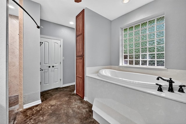 109 Lauren Ln, Pottsboro, TX 75076 - bathroom featuring a garden tub, concrete flooring, and recessed lighting