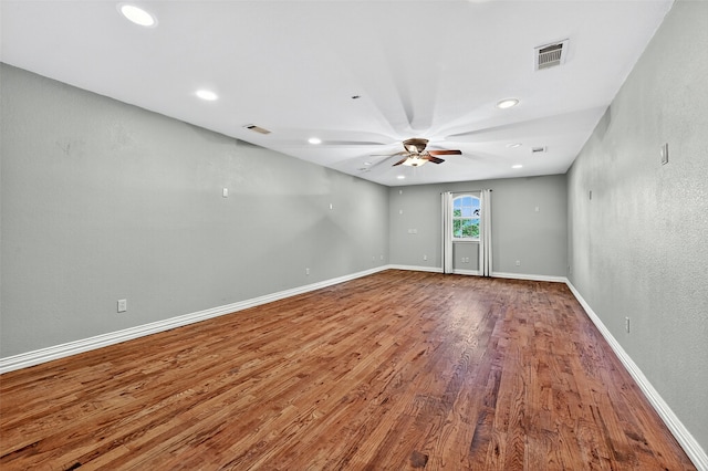 109 Lauren Ln, Pottsboro, TX 75076 - unfurnished room featuring wood finished floors, a ceiling fan, and recessed lighting