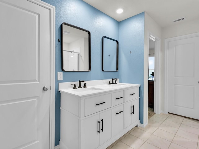 3100 Singleton Rd, Forney, TX 75126 - full bathroom featuring double vanity and tile patterned floors