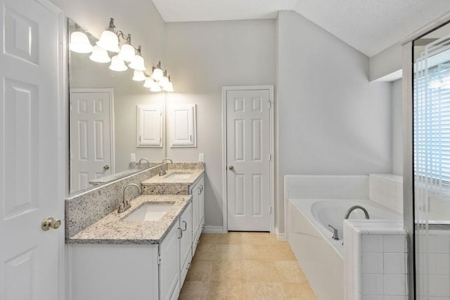 5006 Baton Rouge Blvd, Frisco, TX 75035 - bathroom with double vanity, a bath, a chandelier, and lofted ceiling