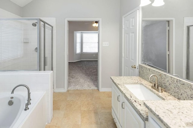 5006 Baton Rouge Blvd, Frisco, TX 75035 - bathroom with vanity, a garden tub, a shower stall, a ceiling fan, and tile patterned flooring