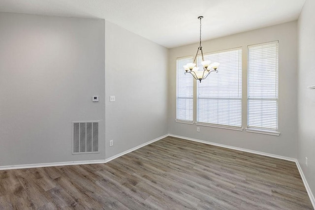 5006 Baton Rouge Blvd, Frisco, TX 75035 - spare room featuring a chandelier and wood finished floors