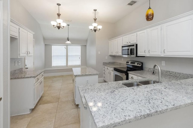 5006 Baton Rouge Blvd, Frisco, TX 75035 - kitchen featuring stainless steel appliances, a chandelier, white cabinets, light stone countertops, and a center island