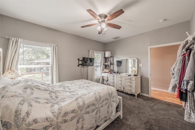 1020 Water St, Waxahachie, TX 75165 - bedroom featuring multiple windows, dark carpet, and ceiling fan