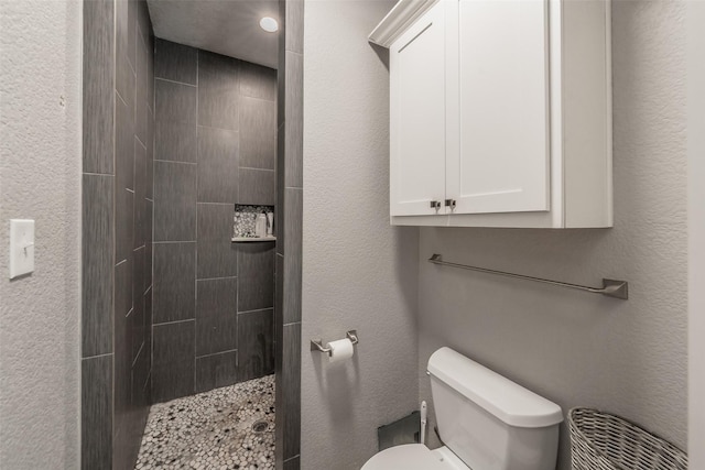 1020 Water St, Waxahachie, TX 75165 - bathroom featuring tiled shower and toilet
