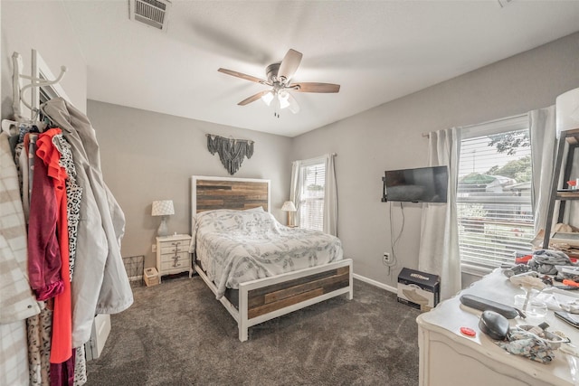 1020 Water St, Waxahachie, TX 75165 - bedroom with dark carpet and ceiling fan
