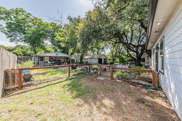 1020 Water St, Waxahachie, TX 75165 - fenced backyard with a storage shed