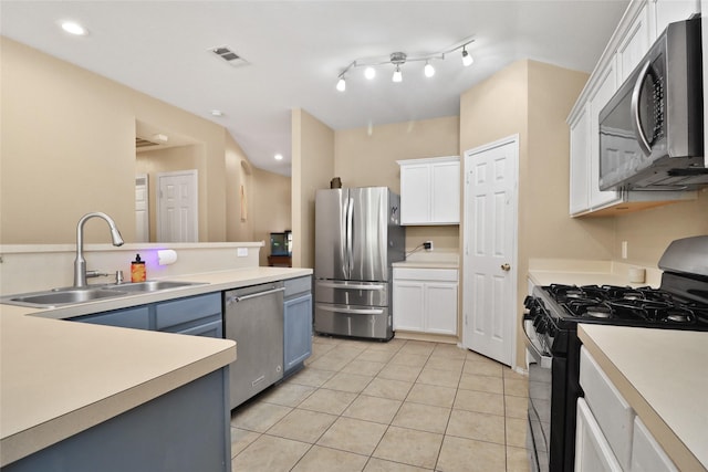 8436 Minturn Dr, Fort Worth, TX 76131 - kitchen with appliances with stainless steel finishes, white cabinetry, light tile patterned flooring, light countertops, and recessed lighting