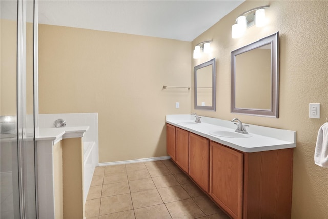 8436 Minturn Dr, Fort Worth, TX 76131 - full bathroom featuring double vanity, a garden tub, and tile patterned floors