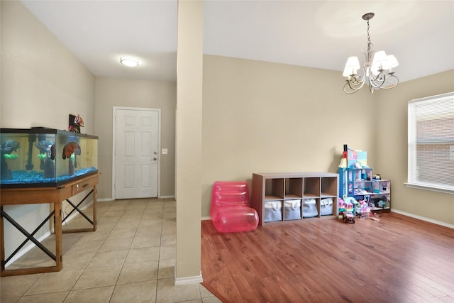 8436 Minturn Dr, Fort Worth, TX 76131 - recreation room with a chandelier and tile patterned flooring