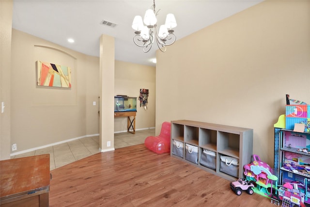 8436 Minturn Dr, Fort Worth, TX 76131 - recreation room featuring a chandelier, wood finished floors, and recessed lighting