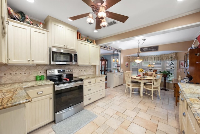 1121 W 3rd Ave, Corsicana, TX 75110 - kitchen featuring stainless steel appliances, crown molding, decorative backsplash, a ceiling fan, and recessed lighting