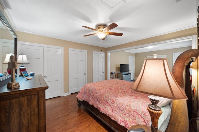 1121 W 3rd Ave, Corsicana, TX 75110 - bedroom with wood finished floors, multiple closets, and a ceiling fan