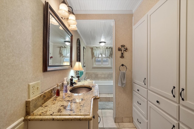 1121 W 3rd Ave, Corsicana, TX 75110 - full bathroom with vanity, ornamental molding, a tub to relax in, and tile patterned floors