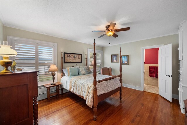 1121 W 3rd Ave, Corsicana, TX 75110 - bedroom with light wood-style flooring, ornamental molding, ceiling fan, a textured ceiling, and a baseboard heating unit