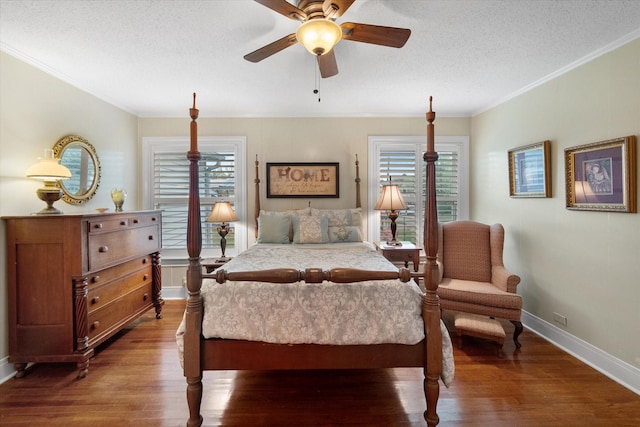 1121 W 3rd Ave, Corsicana, TX 75110 - bedroom with crown molding, wood finished floors, multiple windows, a textured ceiling, and a ceiling fan
