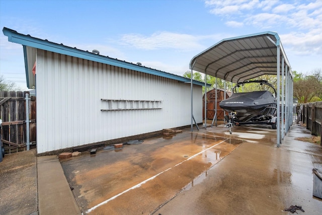 1121 W 3rd Ave, Corsicana, TX 75110 - view of outbuilding with a carport and concrete driveway