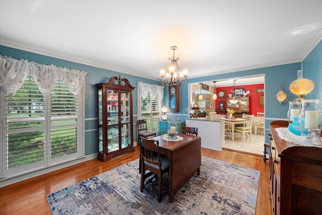 1121 W 3rd Ave, Corsicana, TX 75110 - home office with a chandelier, crown molding, healthy amount of natural light, and light wood-style floors