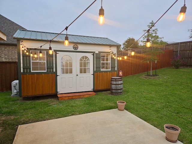 641 Woodridge Dr, Oak Point, TX 75068 - rear view of property featuring a fenced backyard, an outdoor structure, and a metal roof
