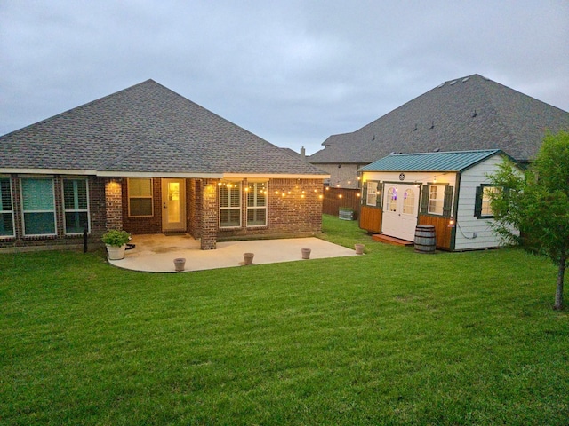 641 Woodridge Dr, Oak Point, TX 75068 - rear view of house featuring an outdoor structure, a patio, and a yard