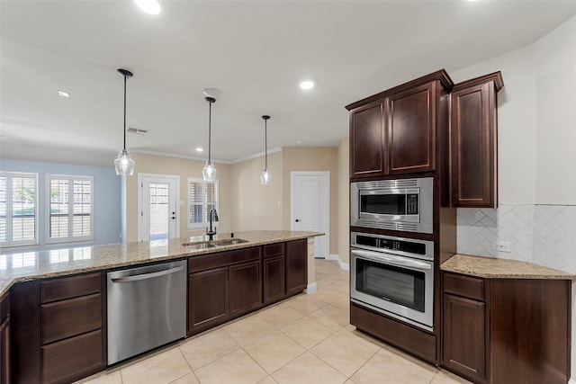 641 Woodridge Dr, Oak Point, TX 75068 - kitchen with stainless steel appliances, dark brown cabinets, light stone countertops, decorative backsplash, and recessed lighting