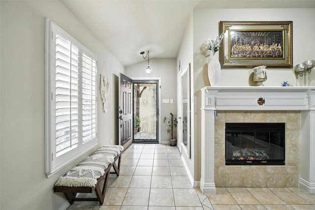 2509 Creek Villas Dr, Bedford, TX 76022 - tiled entrance foyer featuring plenty of natural light, lofted ceiling, and a tile fireplace