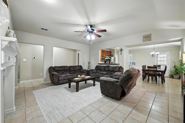 2509 Creek Villas Dr, Bedford, TX 76022 - living area with light tile patterned floors, a ceiling fan, and a chandelier