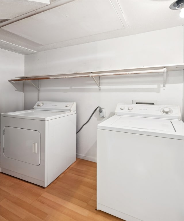 9999 Boat Club Rd Unit 107, Fort Worth, TX 76179 - washroom featuring washing machine and dryer and light wood-type flooring
