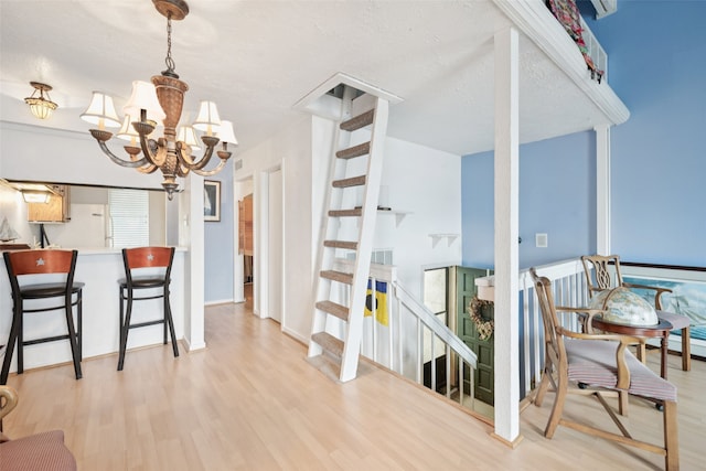 9999 Boat Club Rd Unit 107, Fort Worth, TX 76179 - dining room featuring light wood-type flooring and a chandelier