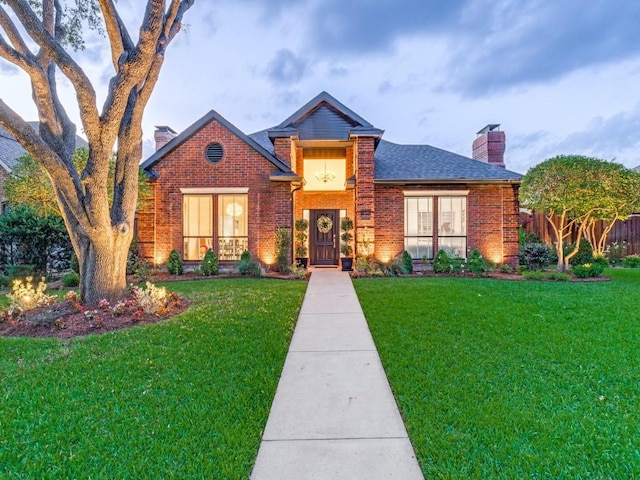 4597 Hallmark Dr, Plano, TX 75024 - view of front of property featuring a chimney, brick siding, and a shingled roof
