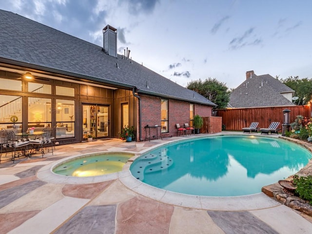 4597 Hallmark Dr, Plano, TX 75024 - view of swimming pool with a patio area and a pool with connected hot tub