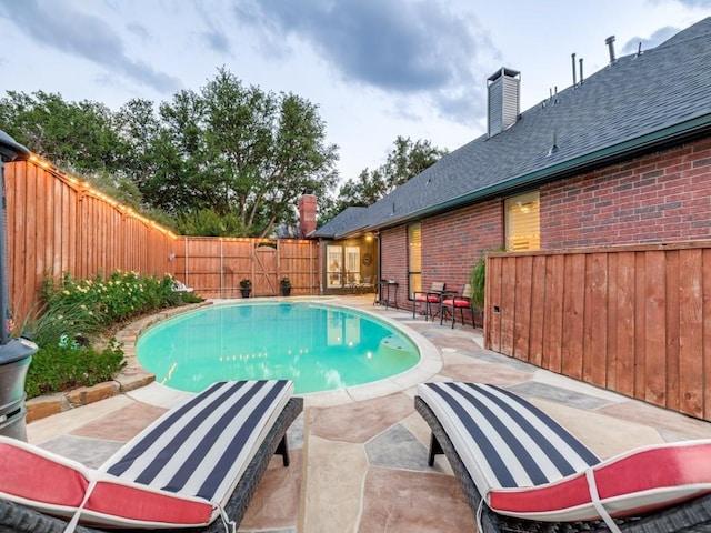 4597 Hallmark Dr, Plano, TX 75024 - view of swimming pool with a patio area and a fenced backyard