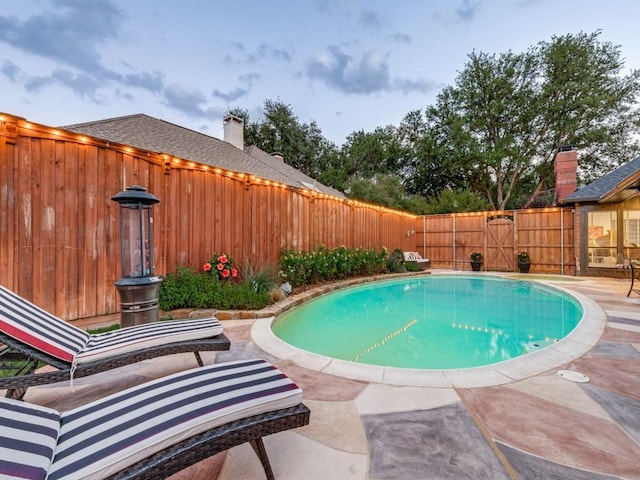 4597 Hallmark Dr, Plano, TX 75024 - view of swimming pool with a fenced backyard and a patio