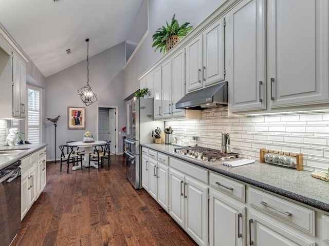4597 Hallmark Dr, Plano, TX 75024 - kitchen featuring under cabinet range hood, dishwasher, decorative backsplash, stainless steel gas stovetop, and high vaulted ceiling