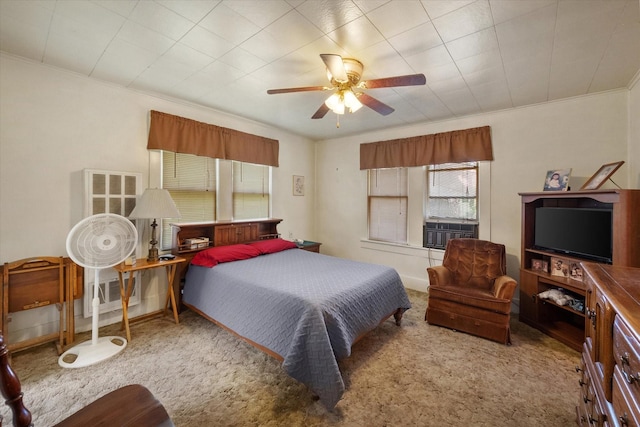 110 Woodland Ave, Corsicana, TX 75110 - carpeted bedroom featuring cooling unit, ornamental molding, and ceiling fan