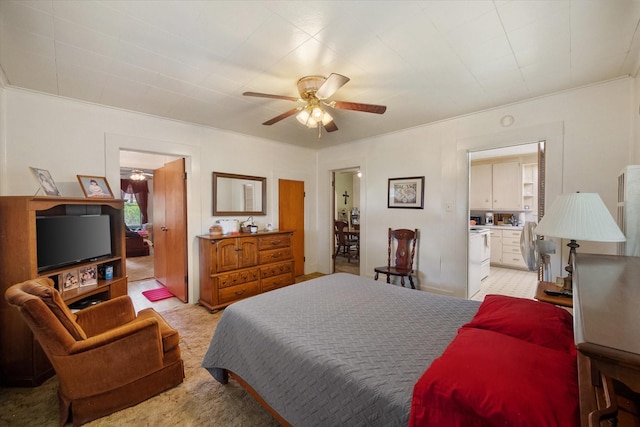 110 Woodland Ave, Corsicana, TX 75110 - bedroom featuring ensuite bathroom, a ceiling fan, and light colored carpet