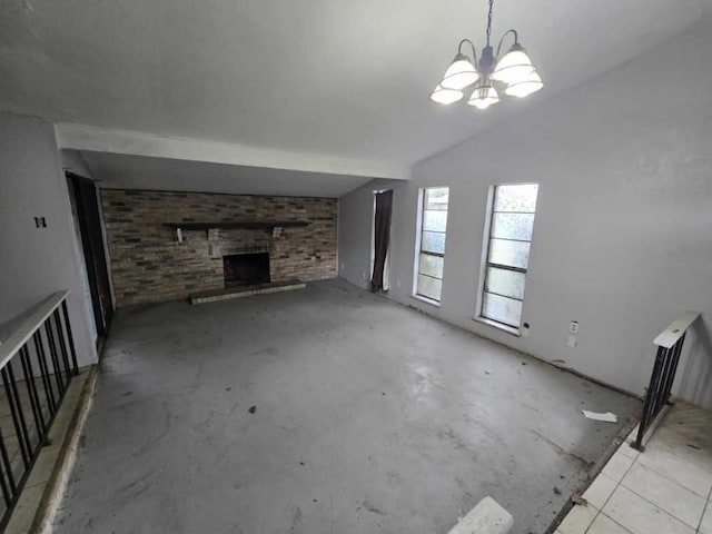 3706 Greenhill Ln, Grand Prairie, TX 75052 - unfurnished living room with a chandelier, a fireplace, and unfinished concrete flooring