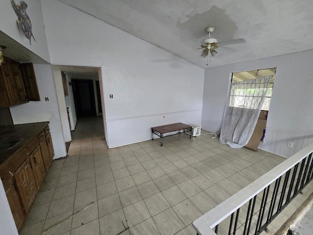 3706 Greenhill Ln, Grand Prairie, TX 75052 - empty room with a ceiling fan, light tile patterned floors, and lofted ceiling