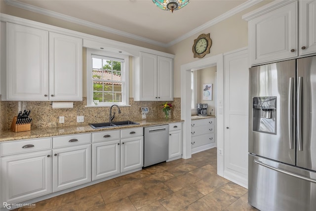 539 Atkins Ave, Shreveport, LA 71104 - kitchen with stainless steel appliances, white cabinetry, tasteful backsplash, crown molding, and light stone counters