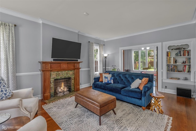 539 Atkins Ave, Shreveport, LA 71104 - living room with wood finished floors, crown molding, healthy amount of natural light, and a high end fireplace