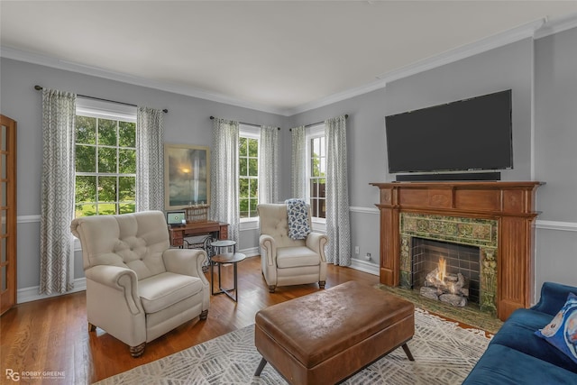 539 Atkins Ave, Shreveport, LA 71104 - living room featuring wood finished floors, healthy amount of natural light, ornamental molding, and a fireplace