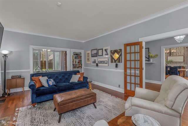 539 Atkins Ave, Shreveport, LA 71104 - living area with ornamental molding, wood finished floors, a chandelier, and french doors