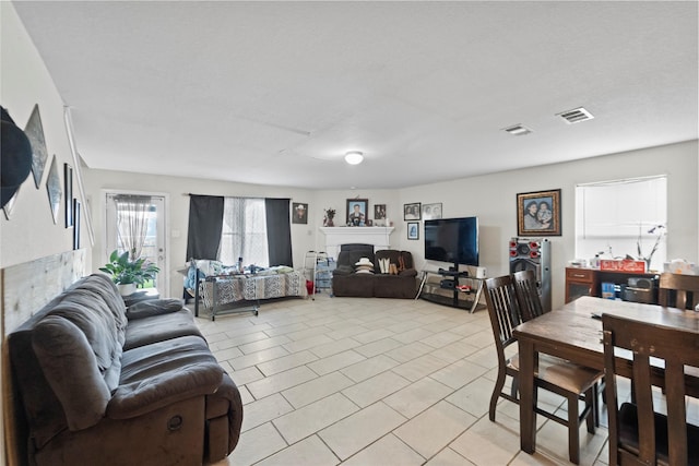 3440 Baby Doe Ct, Fort Worth, TX 76137 - living room featuring a fireplace and light tile patterned floors