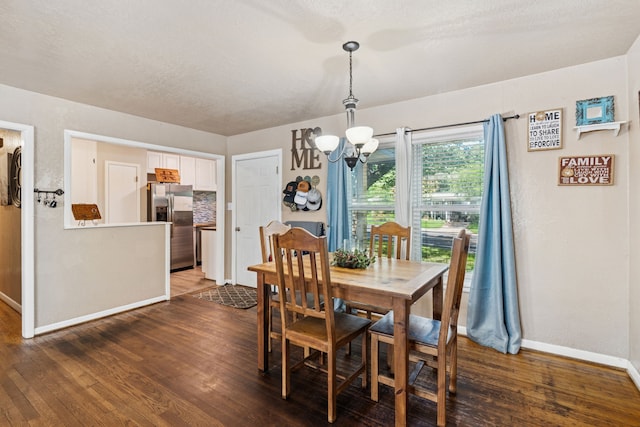 1321 S Lamar St, Weatherford, TX 76086 - dining room featuring a chandelier and wood finished floors