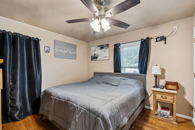 1321 S Lamar St, Weatherford, TX 76086 - bedroom with hardwood / wood-style floors, a textured ceiling, and ceiling fan