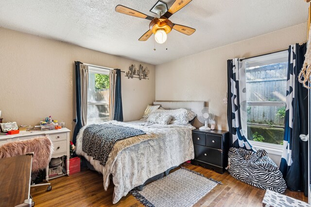 1321 S Lamar St, Weatherford, TX 76086 - bedroom with wood finished floors, a textured ceiling, and ceiling fan